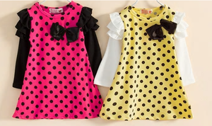 This fun polka dot dress is the perfect piece for a party! We have two vibrant colors in stock - Pink and Yellow. Both colors have long sleeves attached with ruffles on the shoulders. A bow sits on the left chest.