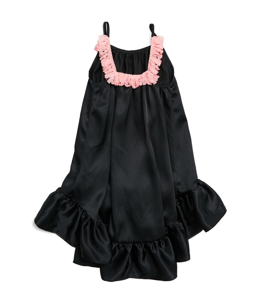 This gorgeous silk dress is just what the beautiful summer weather calls for. This slinky silk bodied dress comes higher in the front and longer in the back turning a fun dress into a fancy party outfit. The front and back are lined with hot pink tassels. Your mini diva will love to give this dress a twirl.