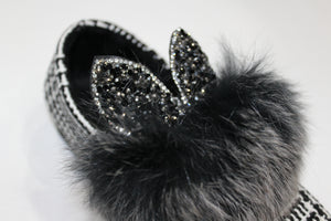 faux fur bunny ear shoes. The bunny ears are filled with black and charcoal rhinestones. 