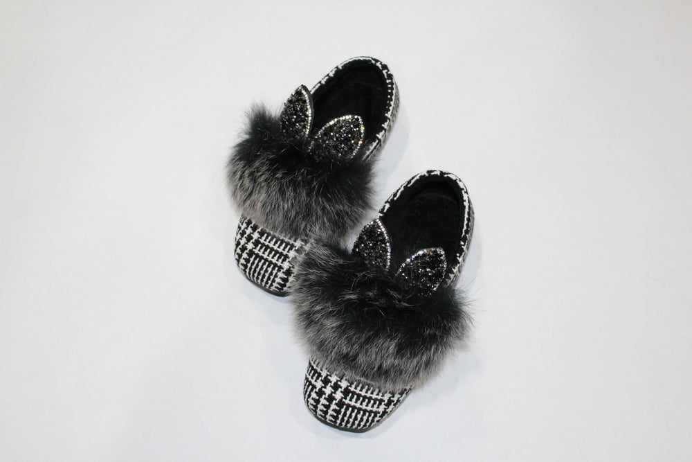 faux fur bunny ear shoes. The bunny ears are filled with black and charcoal rhinestones. 