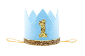 This crown is wrapped in Blue with gold glitter 1 across the top. The dimensions are 8cm wide & 7.3 cm high.