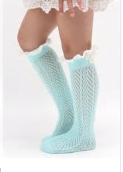 Our Knee High socks can be worn by mini fashionista's ages 3-6. We have two colors; Powder Blue and Pink. Each sock comes with a white ruffle lace located at the top and a structured pattern throughout the entire sock. Add these adorable accessories to any skirt or long blouse to create a fabulous mini diva look! 