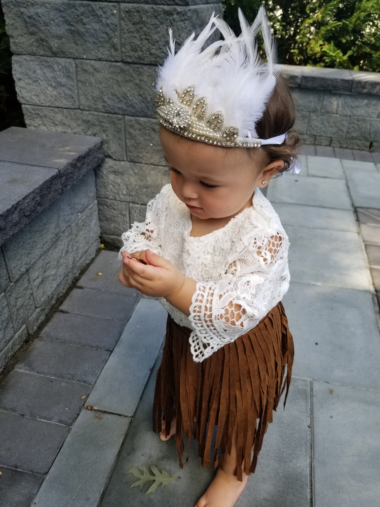 This toddler girl brown skirt is layered with suede fringe. The waist is elastic. 