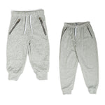 The Littlest Prince French Terry Moto Sweatpants are perfect for a super comfy yet fashionable look. These pants have an elastic waistband and the ankles have a cuffed hem. They also have zipper pockets and moto stitching by the knees.  Make sure to get an extra pair for daddy! Have them matching from head to toe!