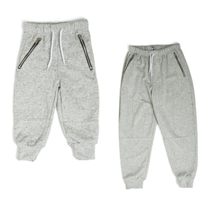 The Littlest Prince French Terry Moto Sweatpants are perfect for a super comfy yet fashionable look. These pants have an elastic waistband and the ankles have a cuffed hem. They also have zipper pockets and moto stitching by the knees.  Make sure to get an extra pair for daddy! Have them matching from head to toe!