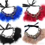 Calling all Boujie Diva's! Our crystal feather necklaces are the perfect addition for our mini diva's all the way up to our mama diva's. Each necklace sits high on top of your existing shirt and is lined with colorful feathers and shining crystals.  Mix and match with your mini for the perfect stylish accessory!  Available in beige, black, red and blue