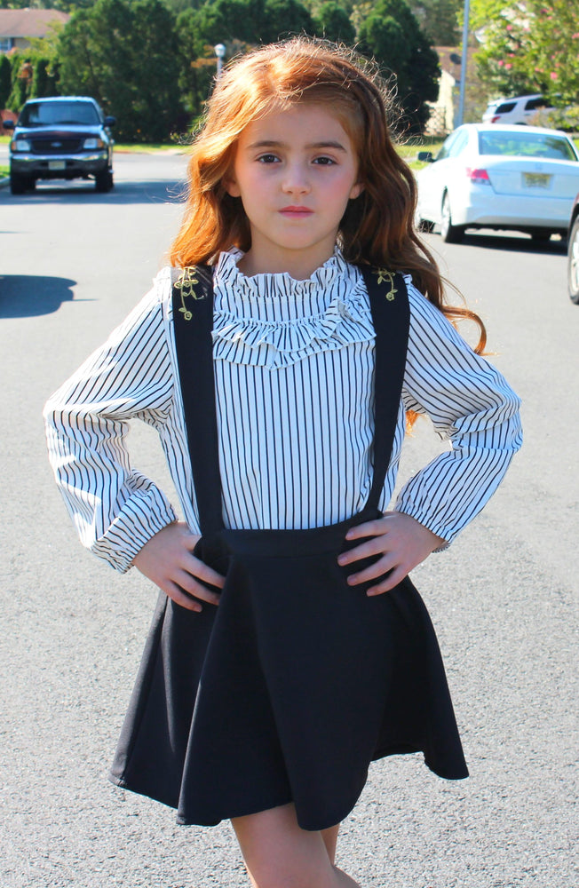 This two piece set is a perfect combo of chic and class for you mini fashionistas! This toddler set includes a long sleeve ruffled collar which fits perfectly into the halter dress. The skirt is pleated for you little princess and gold stitching lines the front and the back of the dress.