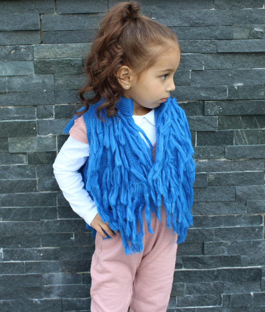 Dress your mini Diva's in this gorgeous blue pop of color for the upcoming Fall season. This vest has hooks that fasten the front closed. The Blue Fringe Vest is light and can be worn underneath a jacket if need be.