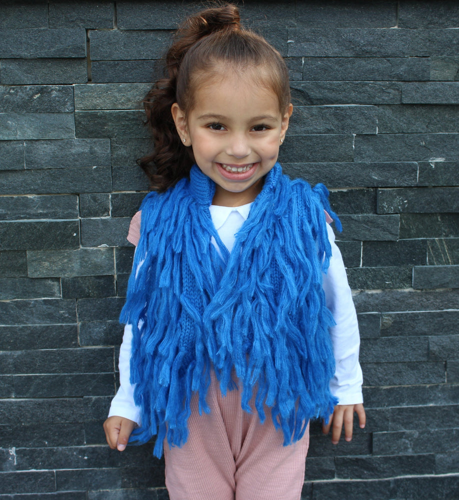 Dress your mini Diva's in this gorgeous blue pop of color for the upcoming Fall season. This vest has hooks that fasten the front closed. The Blue Fringe Vest is light and can be worn underneath a jacket if need be.