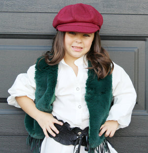 Our Bold Fur Fringe Vest is stunning! This faux fur is oh so soft and the color pops. The bottom of the vest has fringes. Perfect soft and cozy vest for the chilly days.