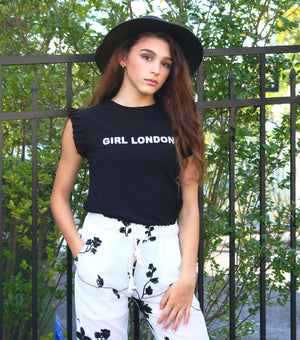 This two piece set is for the classy and sophisticated Boujie Babe. The fashion Girl London two piece set comes with the black flutter top and chiffon pants with drawstring tie. The pants have white shorts inside. The pants are chiffon so they are slightly see through giving it a perfect classic look. Your mini fashionista is ready for Rodeo Drive in this sleek outfit.